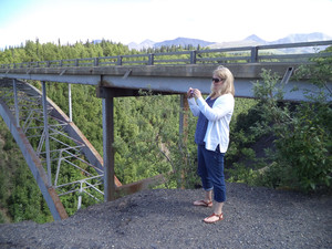 Photo of Ms. DeVries taking pictures at Hurricane Gulch in Alaska.